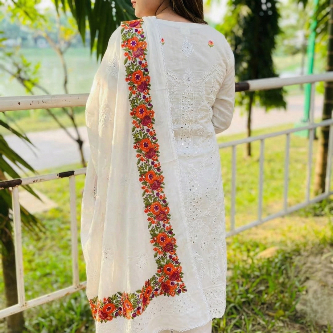 white base contrasted with vibrant, multi colored floral embroidery white base contrasted with vibrant, multi colored floral embroidery
